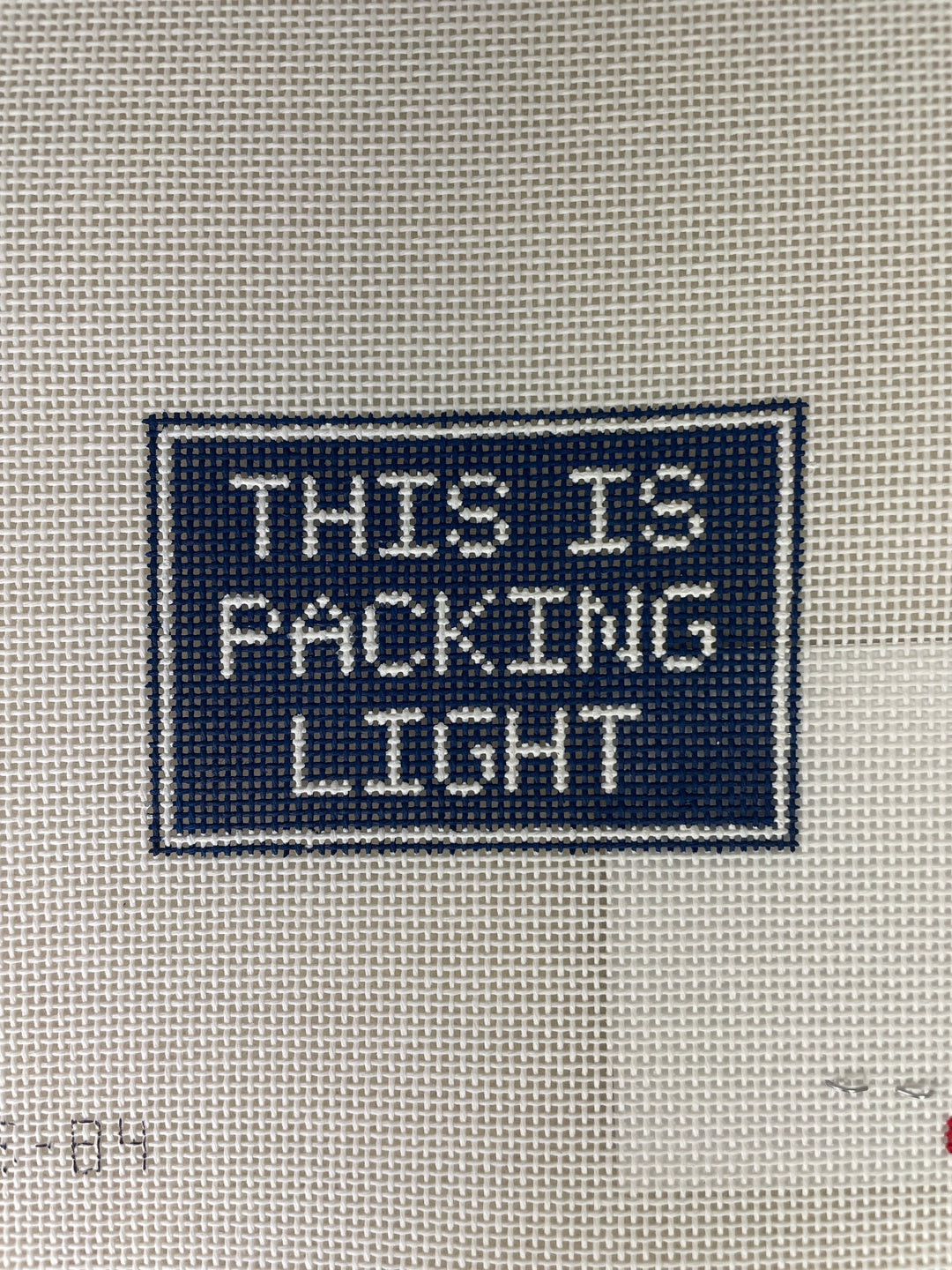 * What's the Stitch Needlepoint / This is Packing Light Luggage Tag